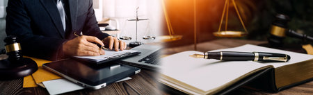 Justice and law concept.Male judge in a courtroom with the gavel, working with, computer and docking...