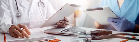 Medicine doctor hand working on a patients x-ray scans digital healthcare and connection with modern...