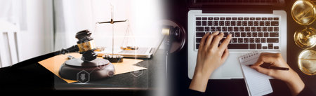 Justice and law concept.Male judge in a courtroom with the gavel, working with, computer and docking...