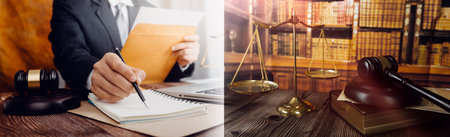 justice and law concept.Male judge in a courtroom on wooden table and Counselor or Male lawyer working in office. Legal law, advice and justice concept.の写真素材