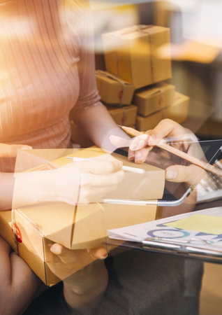 Construction engineer working at blueprint to build large commercial buildings in office. Engineering tools and construction concept.の写真素材