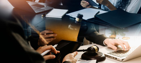 justice and law concept.Male judge in a courtroom on wooden table and Counselor or Male lawyer...