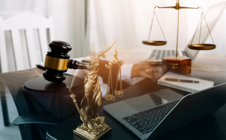 justice and law concept.Male judge in a courtroom on wooden table and Counselor or Male lawyer...