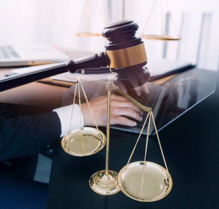 justice and law concept.Male judge in a courtroom on wooden table and Counselor or Male lawyer...