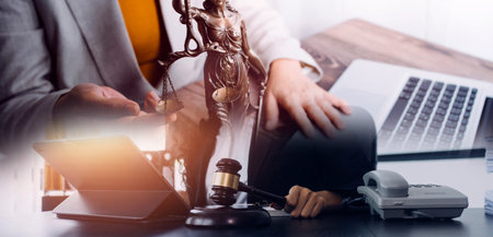 justice and law concept.Male judge in a courtroom on wooden table and Counselor or Male lawyer...