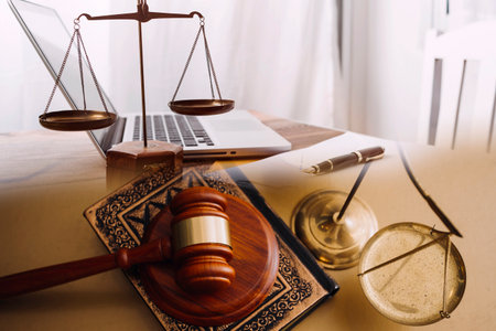 Justice and law concept.Male judge in a courtroom with the gavel, working with, computer and docking...