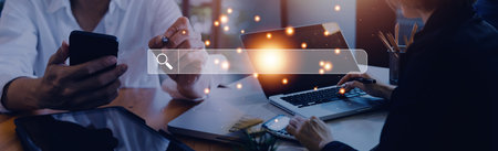 Data Search Technology Search Engine Optimization. man's hands are using a computer keyboard to...