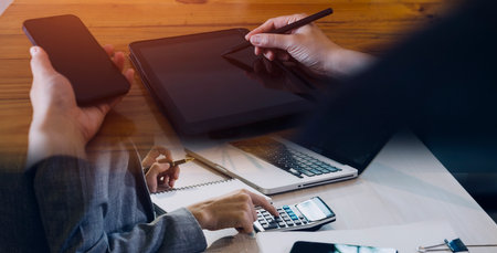 businesswoman hand working with laptop computer, tablet and smart phone in modern office with...