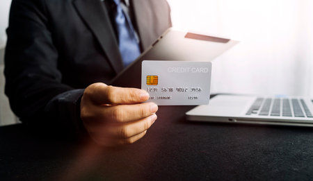 Woman hand using mobile smart phone, online payment, banking and online shopping at the home.の写真素材