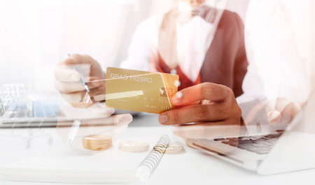 Woman hand using mobile smart phone, online payment, banking and online shopping at the home.の写真素材