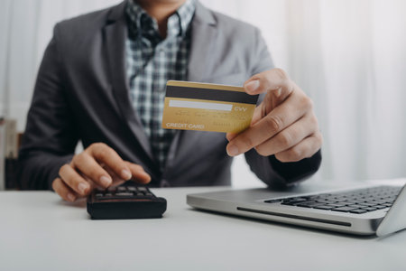 Woman hand using mobile smart phone, online payment, banking and online shopping at the home.