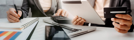 Woman hand using mobile smart phone, online payment, banking and online shopping at the home.