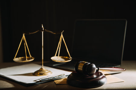 Business and lawyers discussing contract papers with brass scale on desk in office. Law, legal...