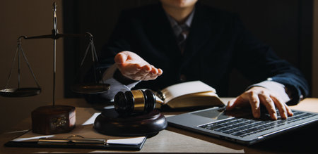 Business and lawyers discussing contract papers with brass scale on desk in office. Law, legal...