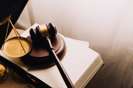 Justice and law concept.Male judge in a courtroom with the gavel, working with, computer and docking...