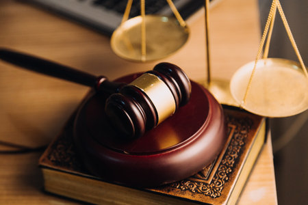 Justice and law concept.Male judge in a courtroom with the gavel, working with, computer and docking...