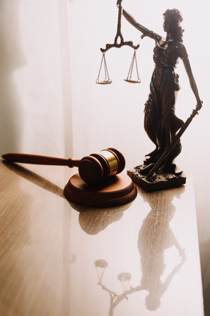 Justice and law concept.Male judge in a courtroom with the gavel, working with, computer and docking...