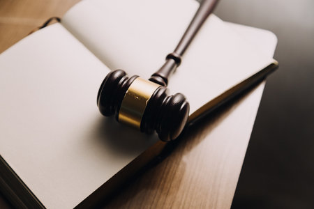 Justice and law concept.Male judge in a courtroom with the gavel, working with, computer and docking...