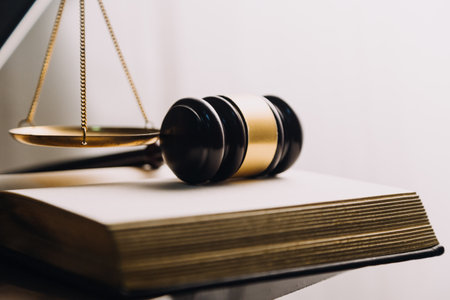 Justice and law concept.Male judge in a courtroom with the gavel, working with, computer and docking...