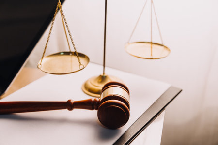 Justice and law concept.Male judge in a courtroom with the gavel, working with, computer and docking...