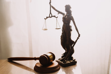 Justice and law concept.Male judge in a courtroom with the gavel, working with, computer and docking...