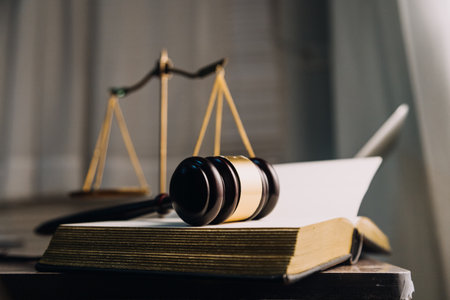 Justice and law concept.Male judge in a courtroom with the gavel, working with, computer and docking...