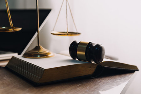 Justice and law concept.Male judge in a courtroom with the gavel, working with, computer and docking...