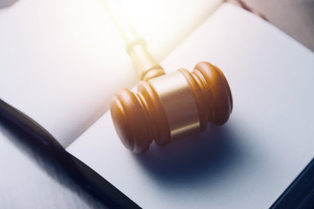 Justice and law concept.Male judge in a courtroom with the gavel, working with, computer and docking...