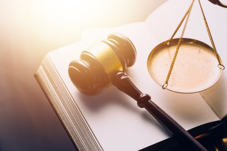 Justice and law concept.Male judge in a courtroom with the gavel, working with, computer and docking...