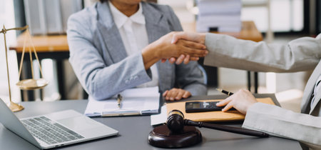 Male lawyer working with contract papers and wooden gavel on tabel in courtroom. justice and law ,attorney, court judge, concept.の写真素材
