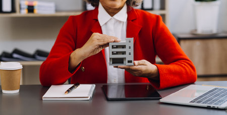 businesswoman hand working with laptop computer, tablet and smart phone in modern office with virtual icon diagram at modernoffice in morning lightの写真素材
