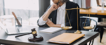 Business and lawyers discussing contract papers with brass scale on desk in office. Law, legal...