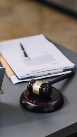 Justice and law concept.Male judge in a courtroom with the gavel, working with, computer and docking...
