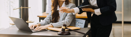 Male lawyer working with contract papers and wooden gavel on tabel in courtroom. justice and law ,attorney, court judge, concept.の写真素材