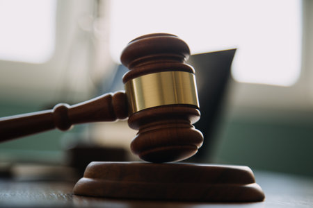 Business and lawyers discussing contract papers with brass scale on desk in office. Law, legal services, advice, justice and law concept picture with film grain effectの写真素材