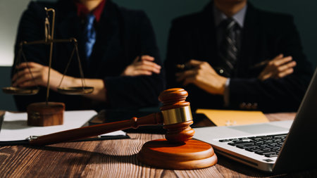 Business and lawyers discussing contract papers with brass scale on desk in office. Law, legal...