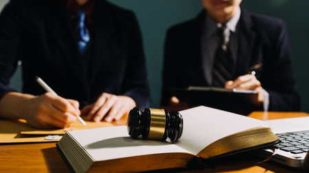 Business and lawyers discussing contract papers with brass scale on desk in office. Law, legal...