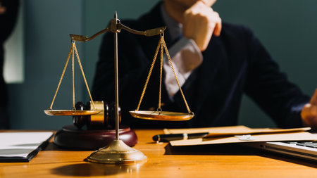 Business and lawyers discussing contract papers with brass scale on desk in office. Law, legal...