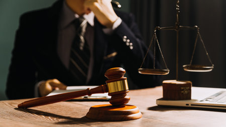 Business and lawyers discussing contract papers with brass scale on desk in office. Law, legal...