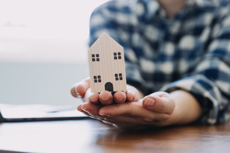 Signing home sales and insurance contracts with real estate agents, signing contracts to know the terms of buying and selling homes and real estate, contract signing ideas.の写真素材