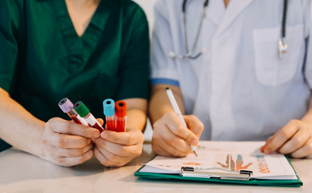 Checking the breath. Male veterinarian in work uniform listening to the breath of a small dog with a phonendoscope in veterinary clinic. Pet care conceptの写真素材