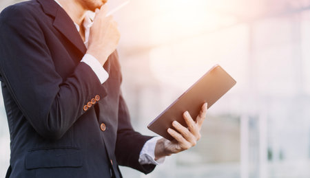Working together on project. Two young business colleagues working on computerの写真素材