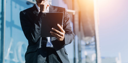 Working together on project. Two young business colleagues working on computerの写真素材