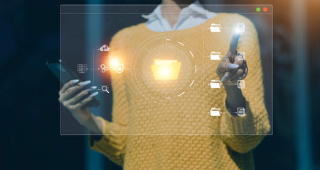 Document management system concept, Businessman signs electronic documents on digital documents, searching and managing files online document database, for efficient archiving and company dataの写真素材