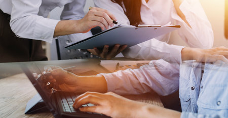 close up hands multitasking man using tablet, laptop and cellphone connecting wifi