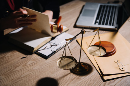 Justice and law concept.Male judge in a courtroom with the gavel, working with, computer and docking...