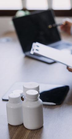 Homecare nursing service and elderly people cardiology healthcare. Close up of young hispanic female doctor nurse check mature caucasian man patient heartbeat using stethoscope during visitの写真素材