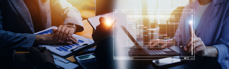 Analyst working with computer in Business Analytics and Data Management System to make report with...