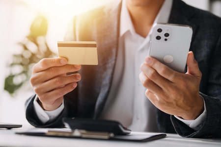 Close up of woman hand using credit card and laptop for payment and online shopping, Online...