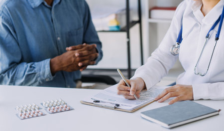 Male Doctor writing out RX prescription, copy space, consent contract sign prescribe a remedy healthy lifestyle healthcare Online medical service conceptの写真素材